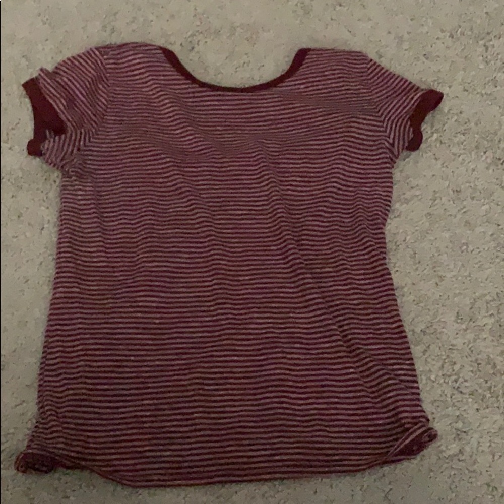 A t-shirt it is like a pink and purple striped